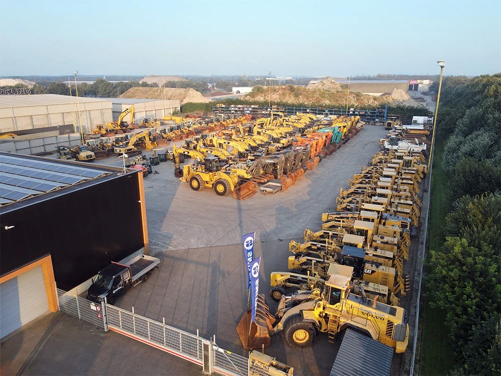 Equipment lined up across the dealership yard