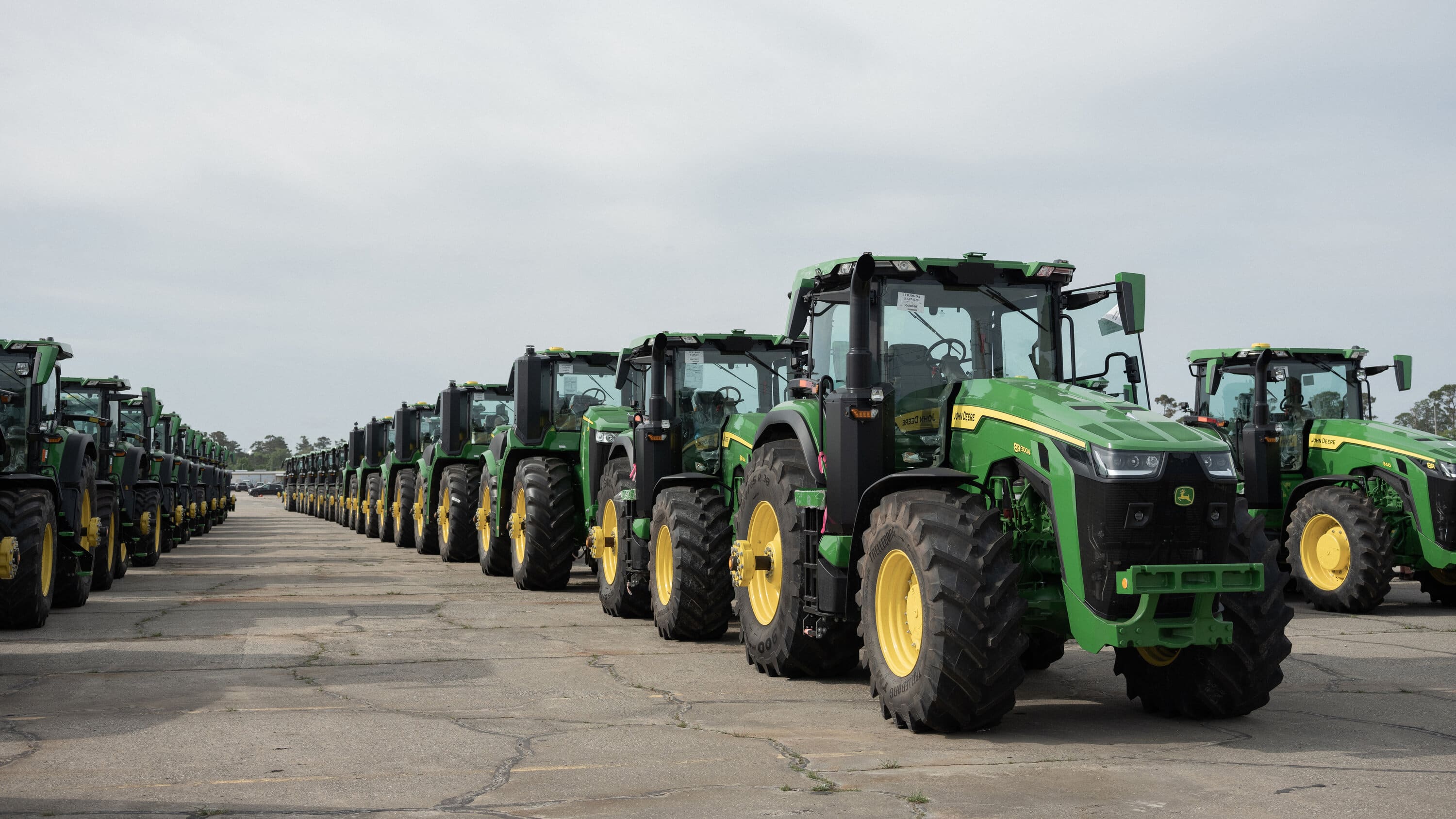 Equipment lined up across the dealership yard